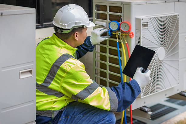 Professional Hvac technician working in Bedford, MA